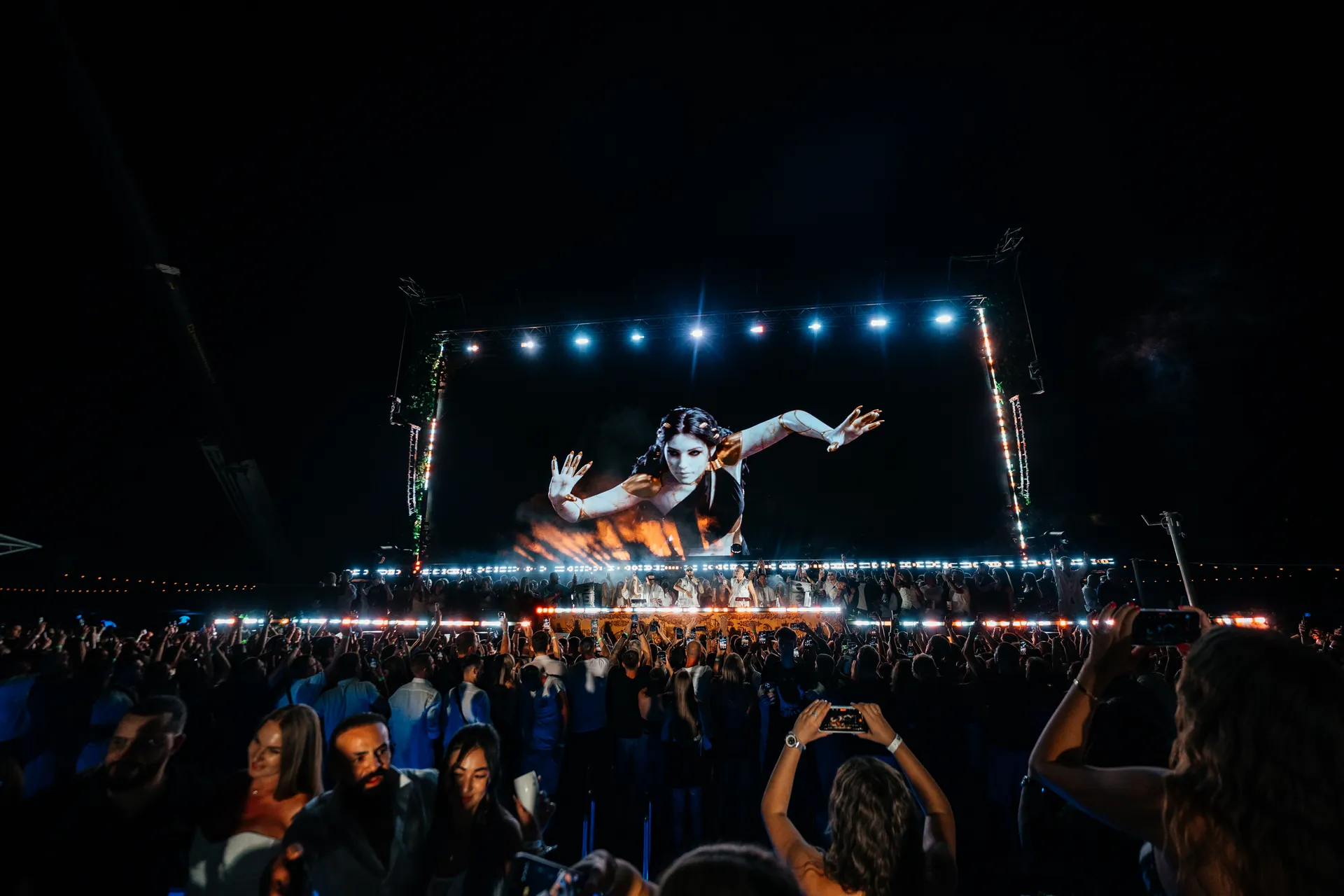 Awakening of Eras — painted figure reaching from the LED wall