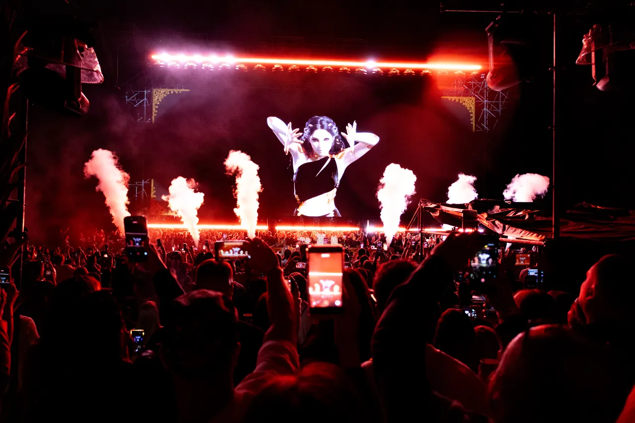 Crowd filming the LED show on their phones