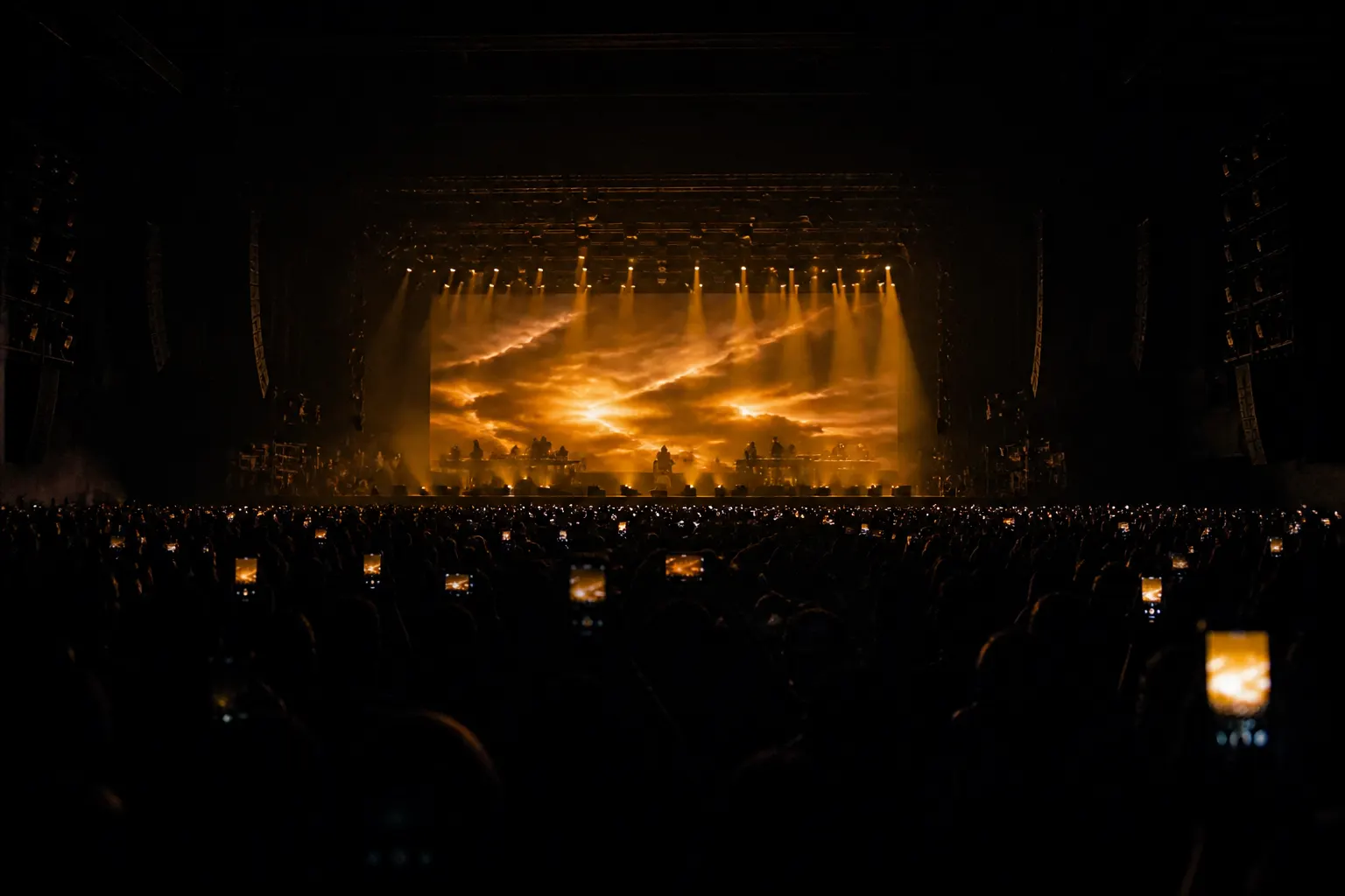 Wide shot of stage production with crowd